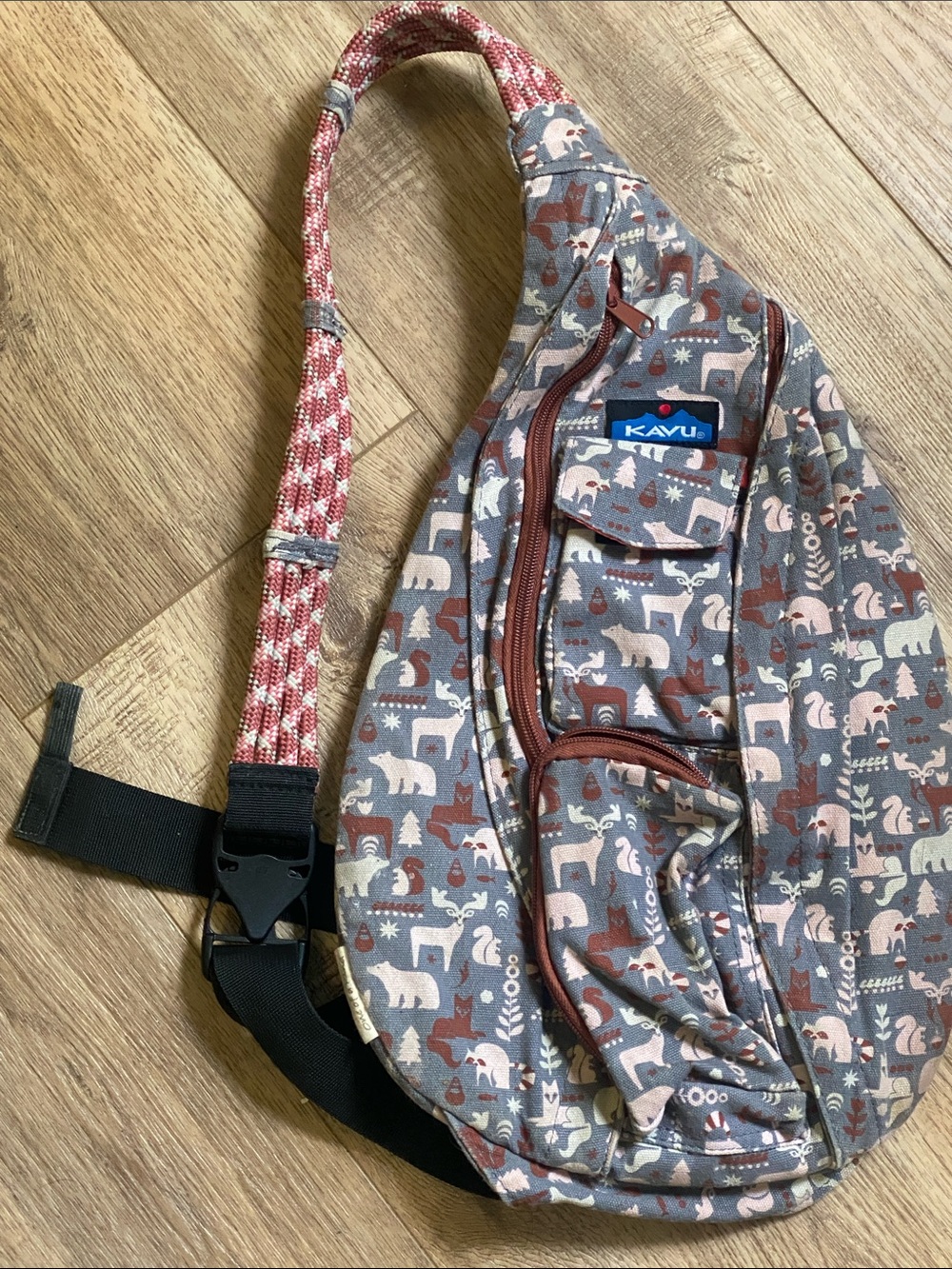 Kavu Gray Sling Bag with Rust and Cream Woodland Print